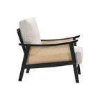 black indoor rattan armchair with curved open weave design, white background, side view.
