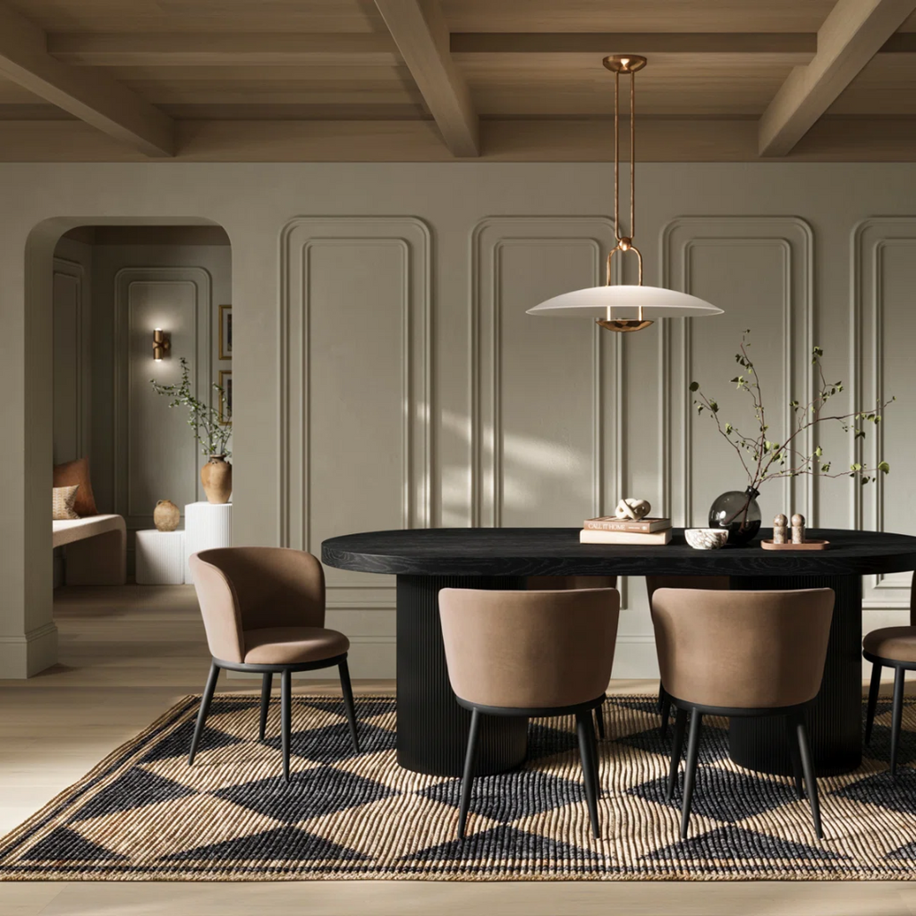 Modern dining room with a black oval table and beige chairs.