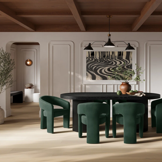 Modern dining room with green chairs and a black table, featuring a decorative wall piece.