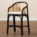Black rattan chair with a white cushion on a wooden floor.