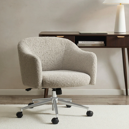 Beige textured office chair in a room with a desk and lamp.