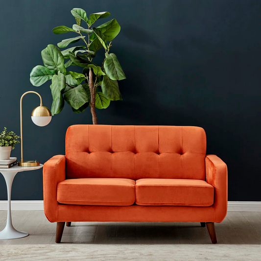 Contemporary 2-Seater Burnt Orange Sofa, set in a model home, front view.