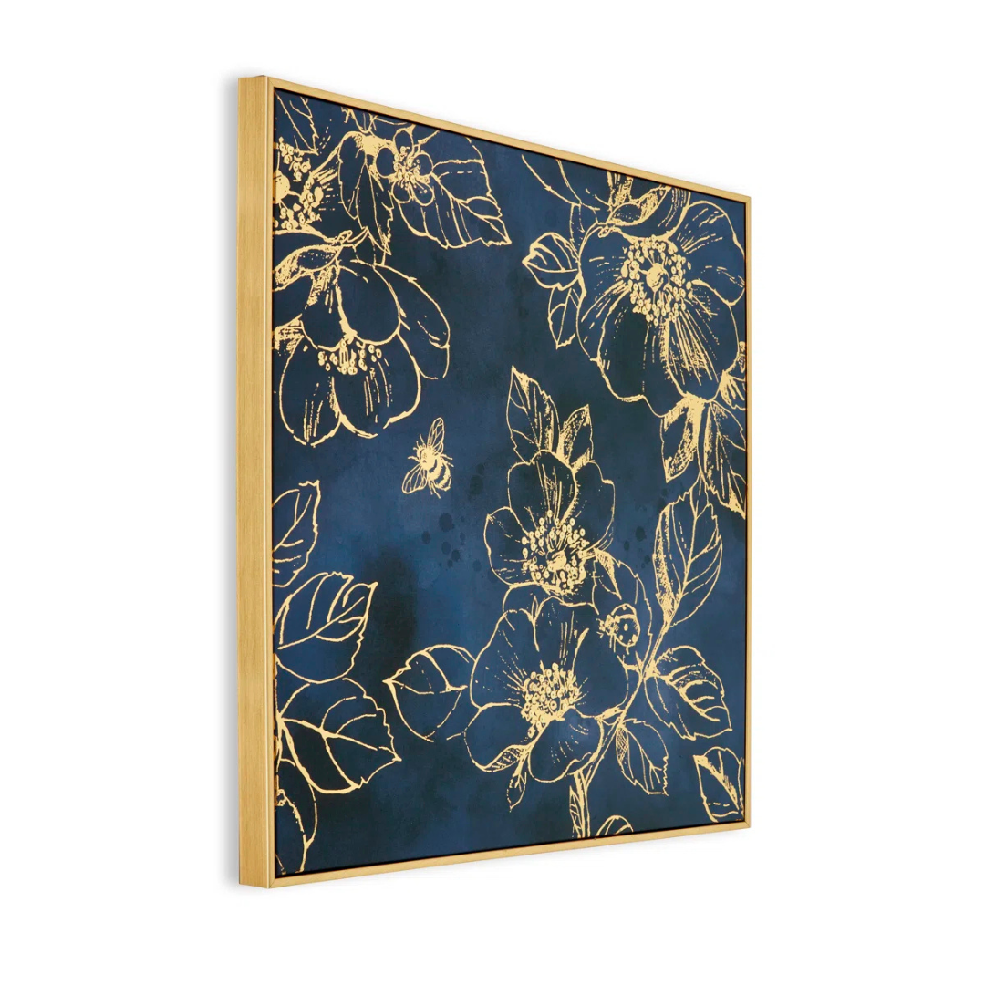 Framed artwork with gold floral design on a blue background