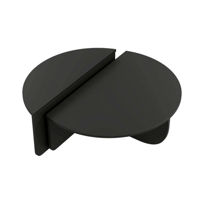 Contemporary low round coffee table with magazine slot, black table with a white background.