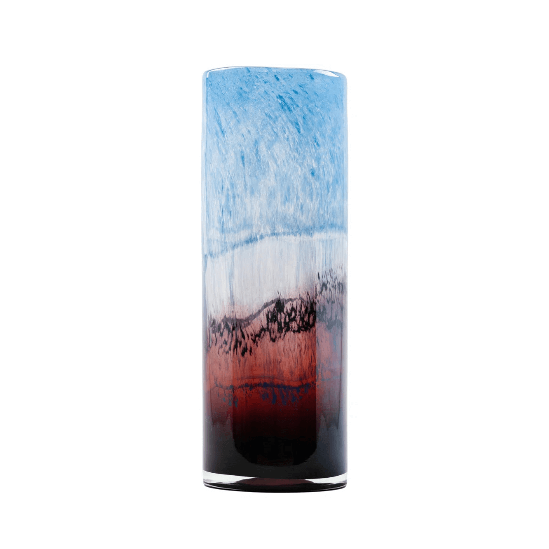 Tall cylindrical glass with blue and red gradient on a white background