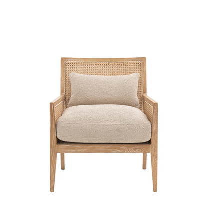Beige armchair with woven backrest on a white background