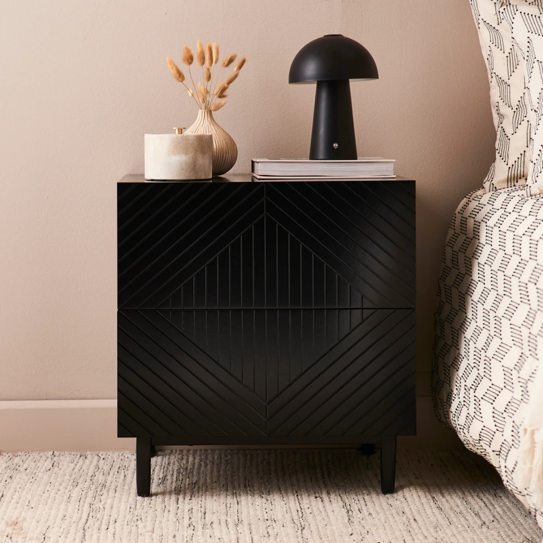 Geometric Bedside Cabinet Black, front view, set in a model home.