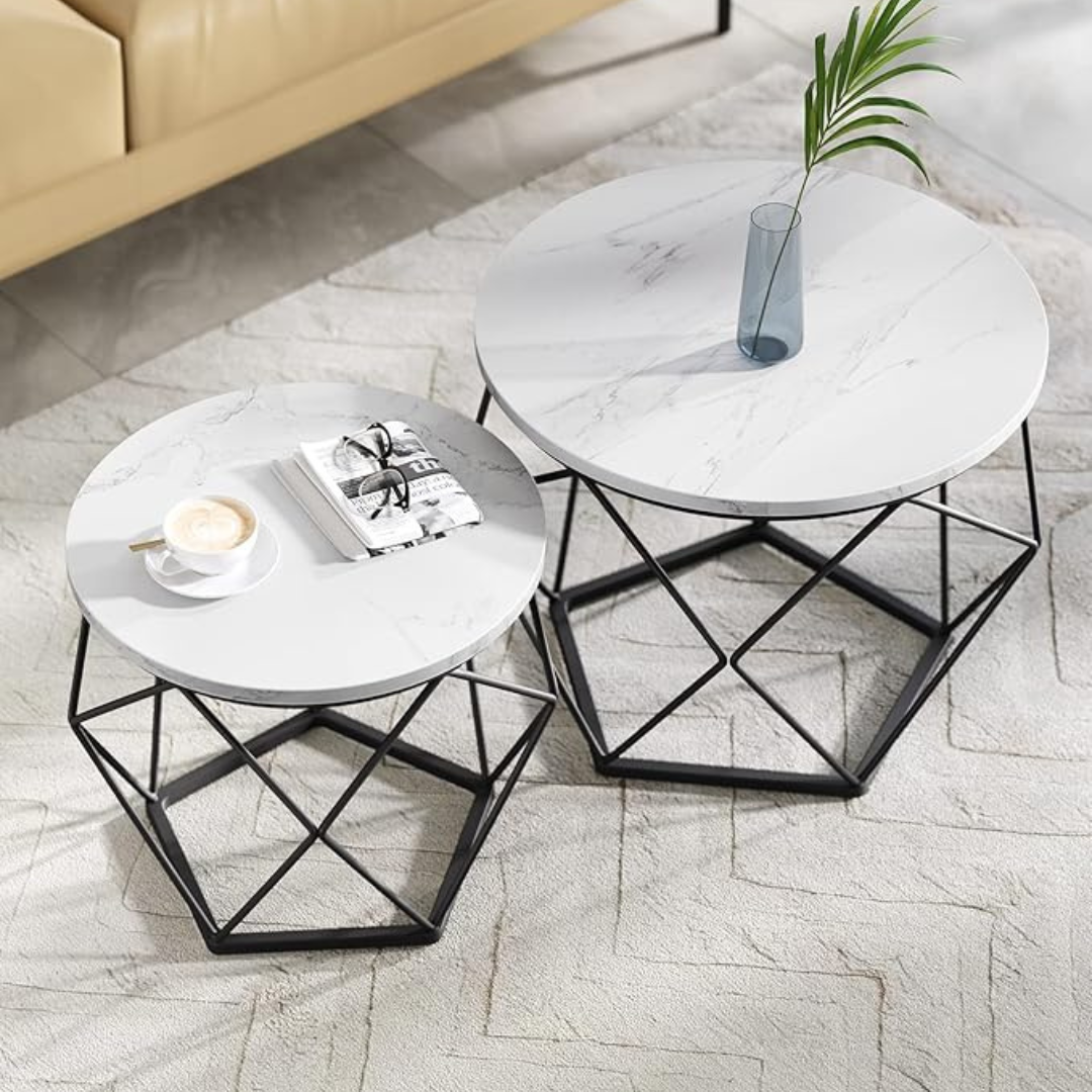 Geometric coffee table set with sculptural metal bases, top view of white tables.
