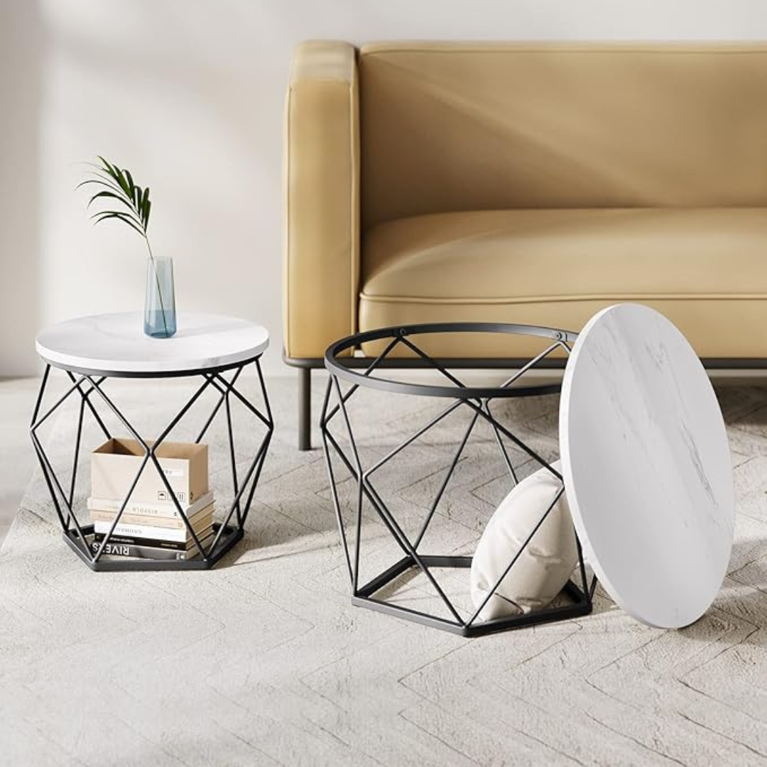 Geometric coffee table set with sculptural metal bases, white, in a modern living room.