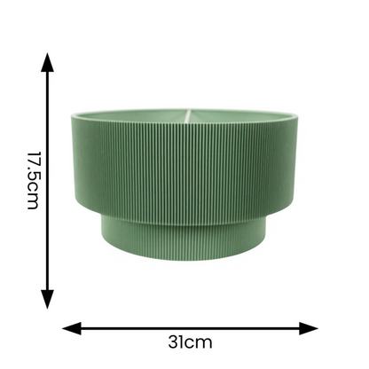 Green ribbed planter with dimensions on a white background
