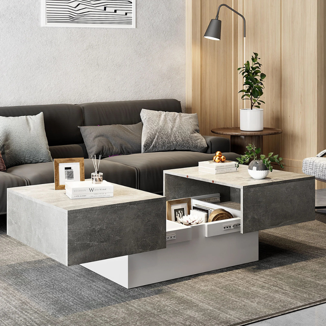 Grey modern coffee table with hidden storage drawers, set in a modern living room.