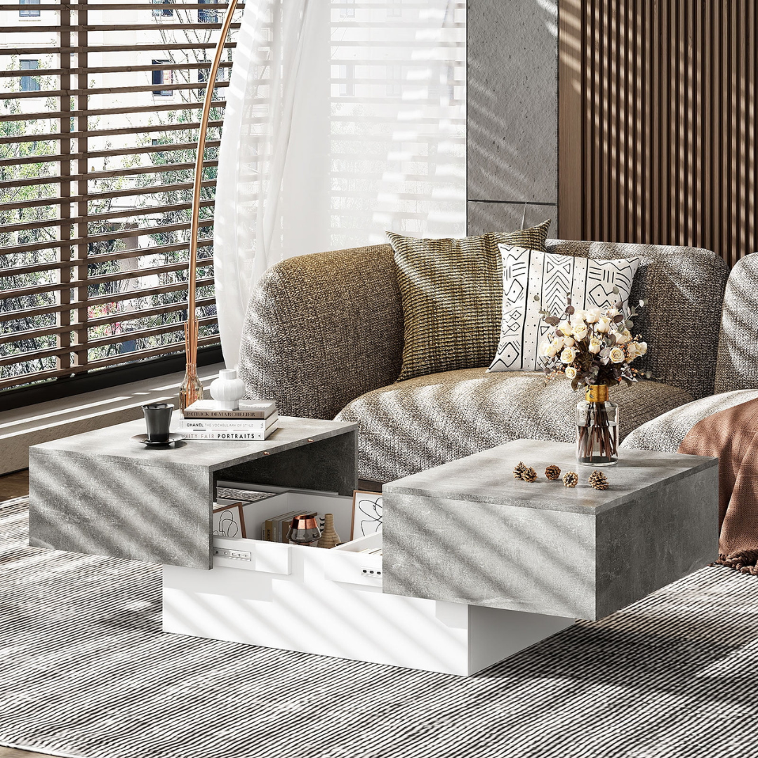 Grey modern coffee table with hidden storage drawers, with drawers open in modern home.