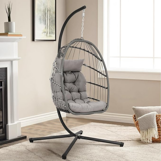 Grey Rattan Hanging Egg Chair And Stand, set in a modern home.