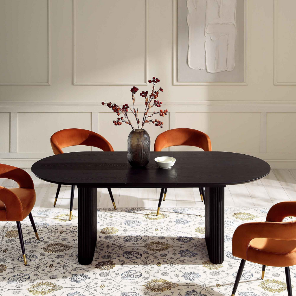 Japandi Black Oval Extending Dining Table, extended in a modern dining room, front view.