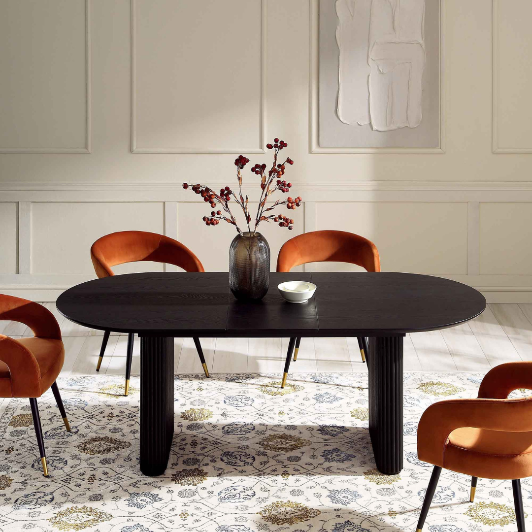 Japandi Black Oval Extending Dining Table, extended in a modern dining room, front view.