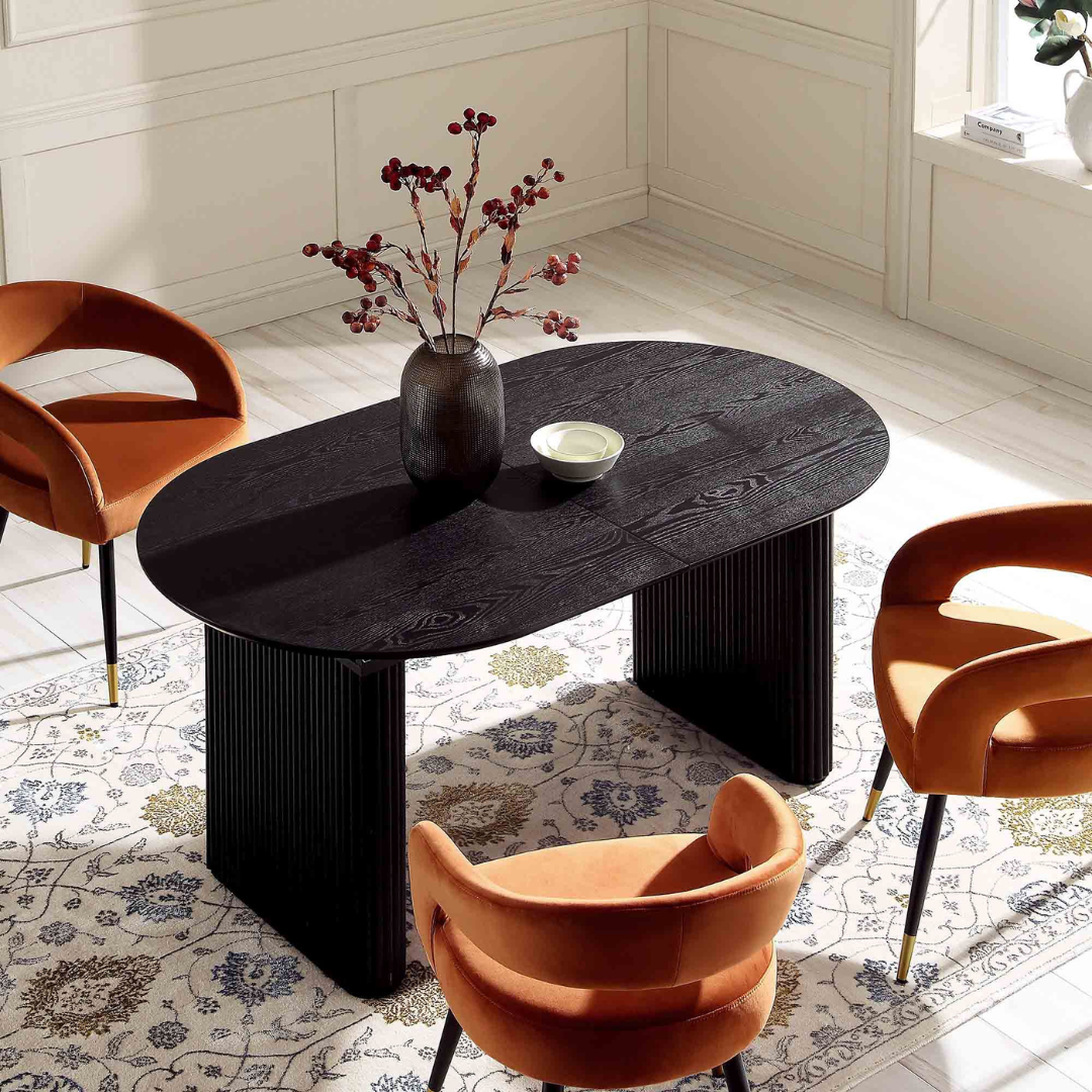 Japandi Black Oval Extending Dining Table, not extended in a modern dining room.