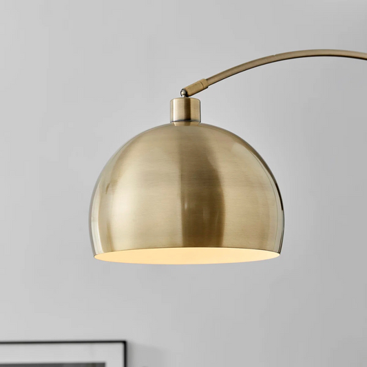 Gold pendant light on a gray background