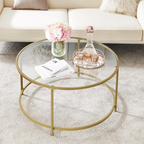 Round glass coffee table with gold metal frame in a living room setting.