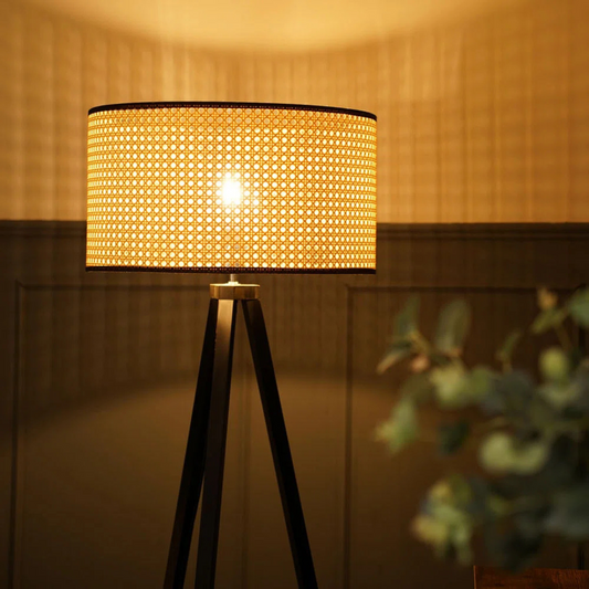 Floor lamp with a textured lampshade in a warm indoor setting