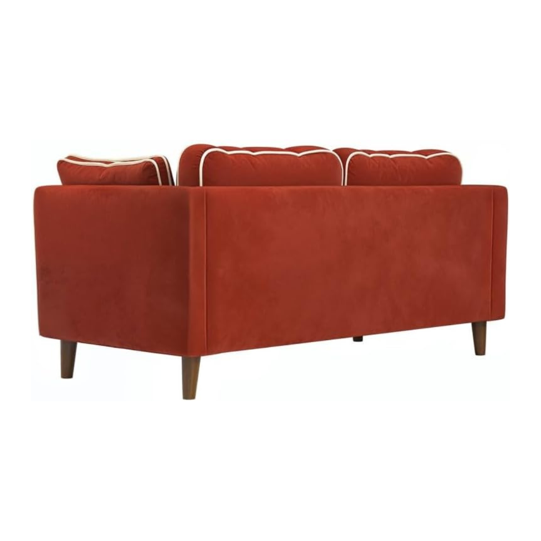 Red sofa with white trim on a white background