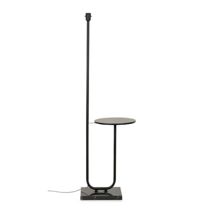Black floor lamp with a small round table on a white background