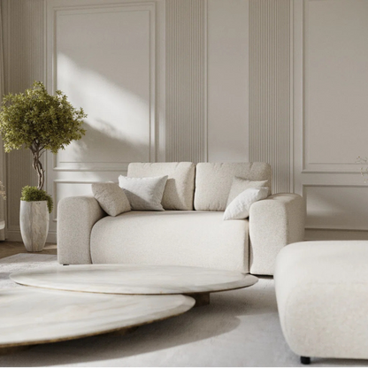 Modern 2-Seater Cream Boucle Sofa, set in a modern home, close up. 