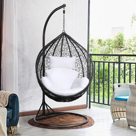 Modern Black Hanging Egg Chair With Stand, set in a modern home.