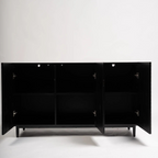 Modern Black Wood Sideboard, studio background, with doors open to show storage.