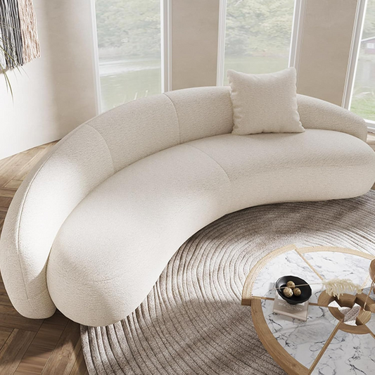 Modern Curved White Boucle Sofa, set in a modern home.