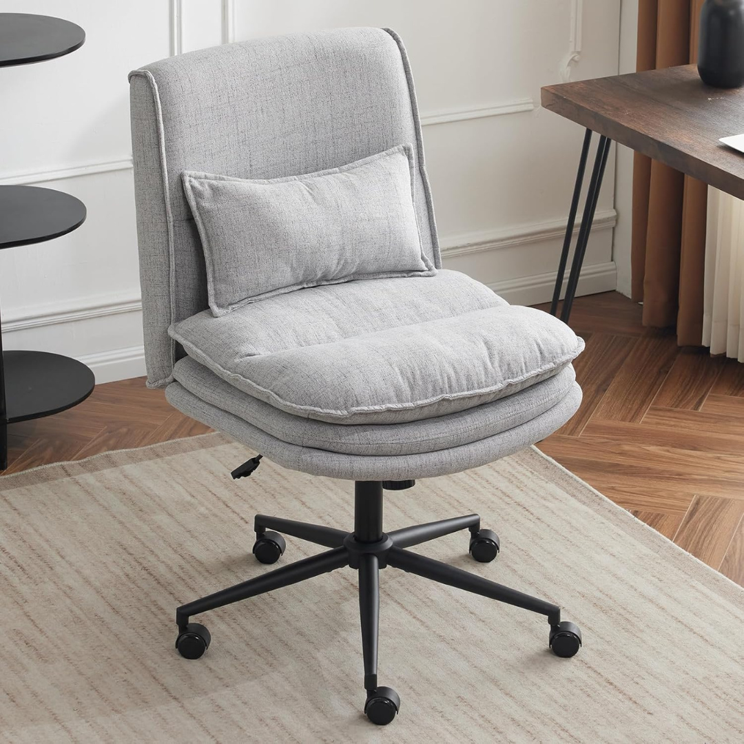 modern ergonomic armless office chair with cushioned seat, grey chair in a modern office.