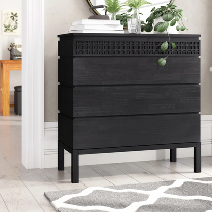 Modern Solid Black Wooden Chest Of Drawers, set in a modern home, front view.