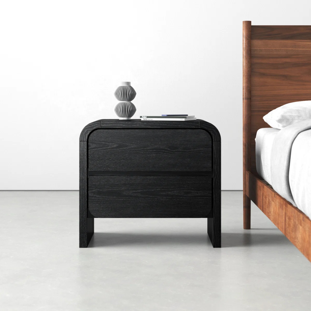 Modern Solid Wood Bedside Cabinet Black, front view, in a model home.