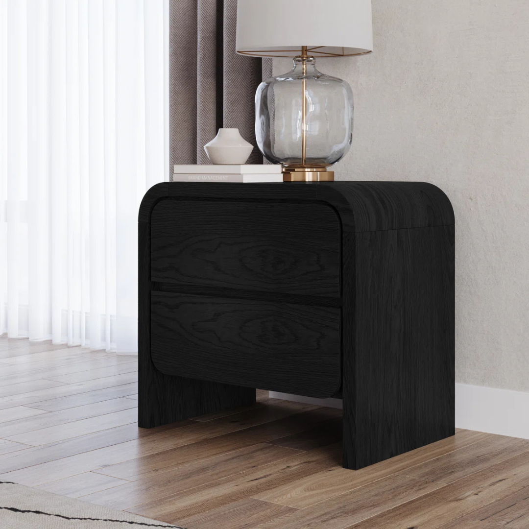 Modern Solid Wood Bedside Cabinet Black, angled view in a model home.