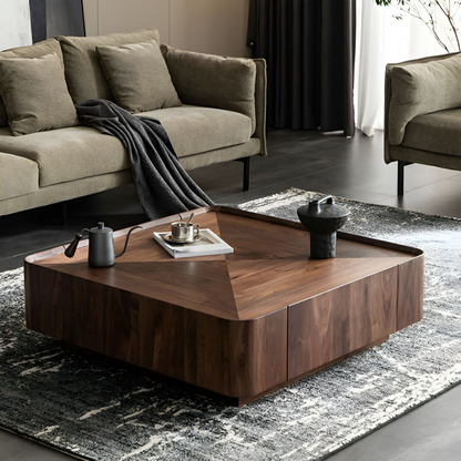Modern walnut square coffee table with sculpted top in a living room setting, high angle view.