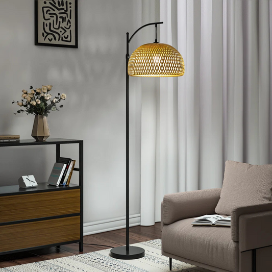 Living room with a floor lamp, sofa, and side table.