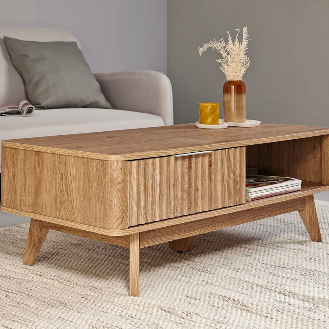 Modern wooden coffee table with drawer and shelf, set in a modern home.