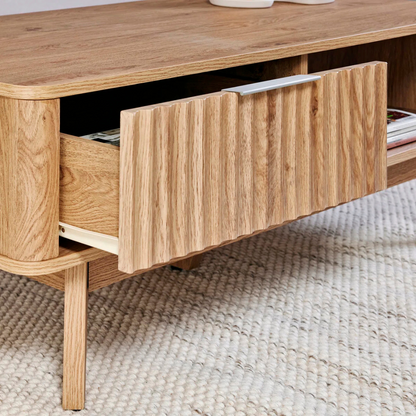 Modern wooden coffee table with drawer and shelf, close up to the drawer.