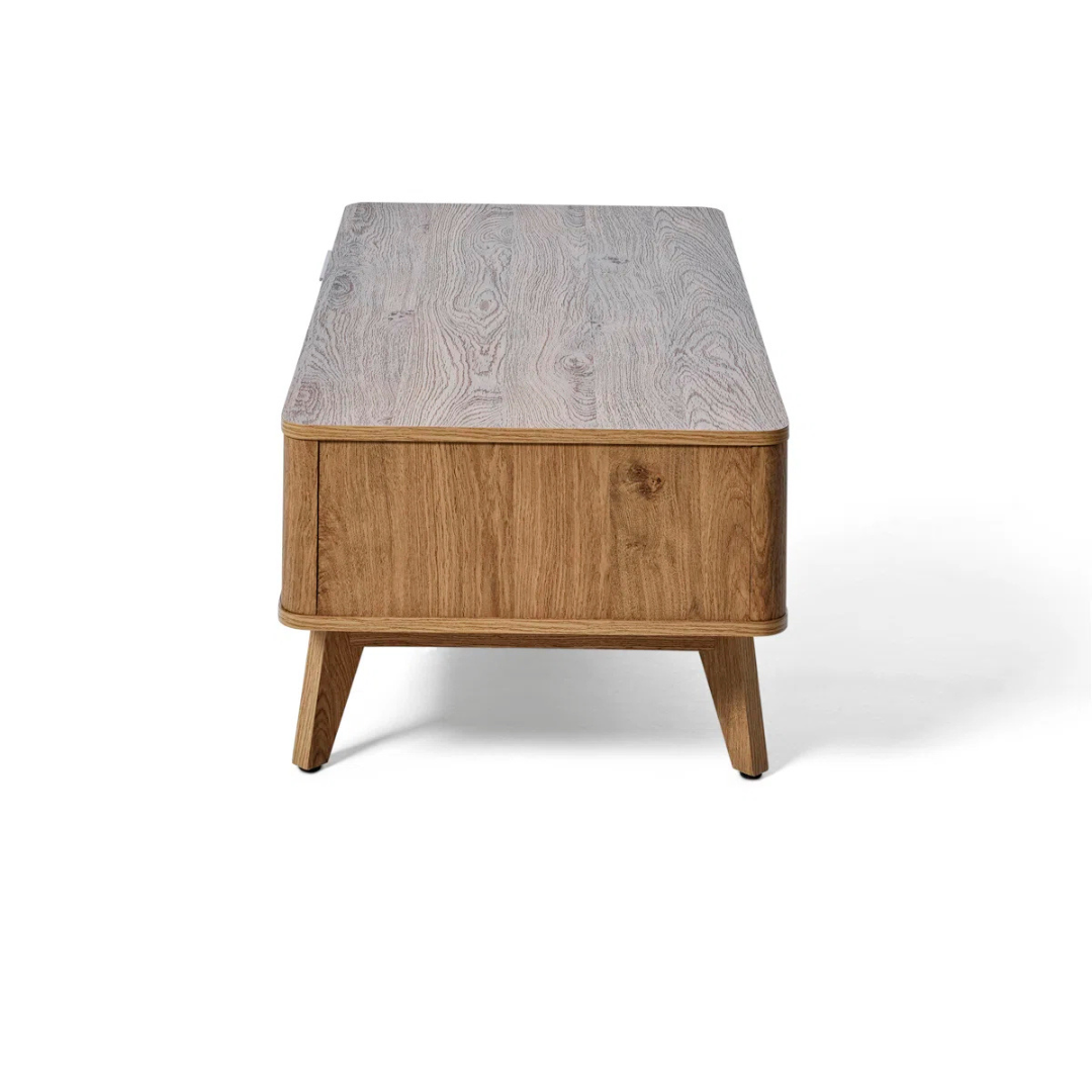 Modern wooden coffee table with drawer and shelf, side view, white background.