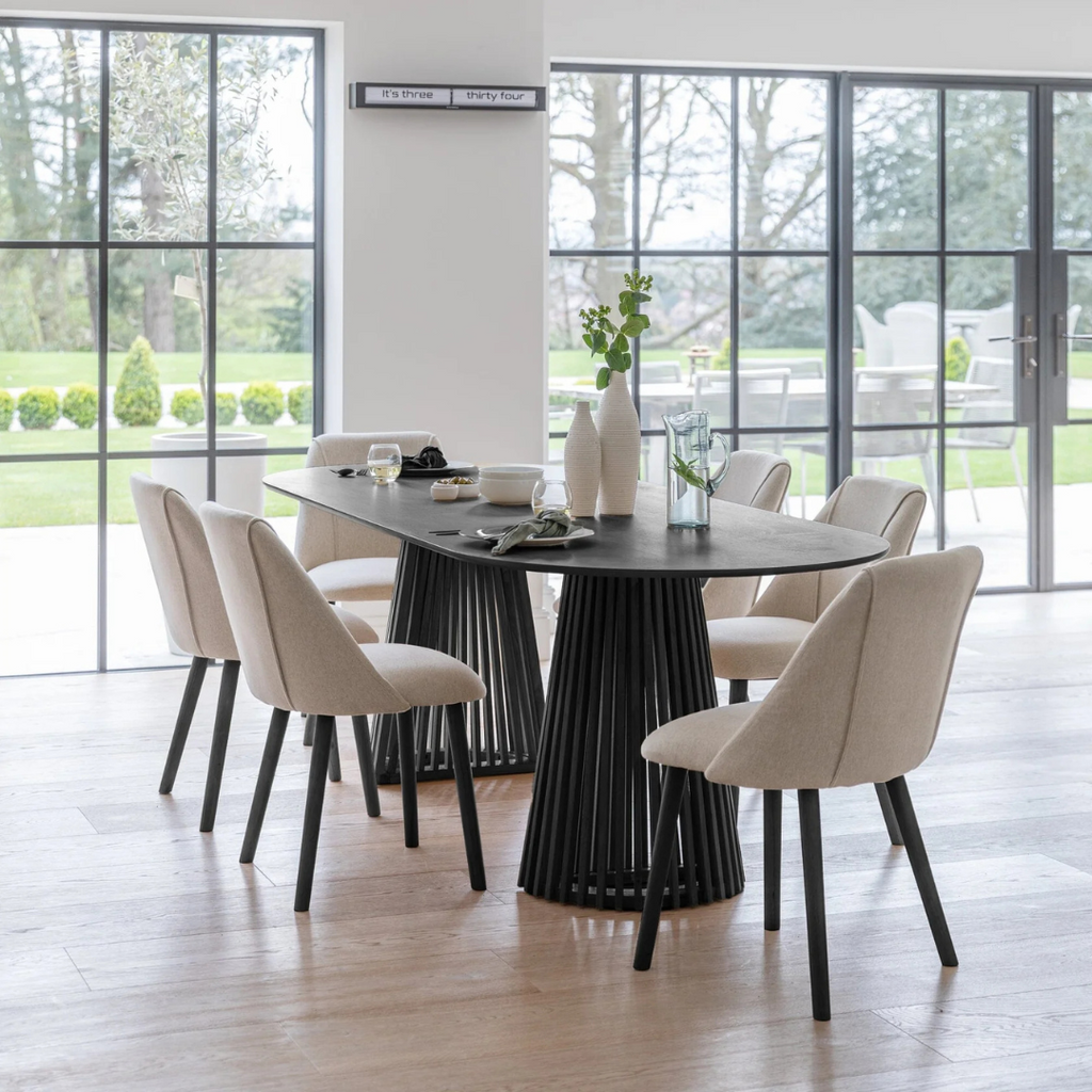 Modern Scandinavian Dining Table Black, set in a modern home with 6 dining chairs.