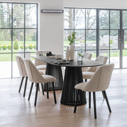 Modern Scandinavian Dining Table Black, set in a modern home with 6 dining chairs.