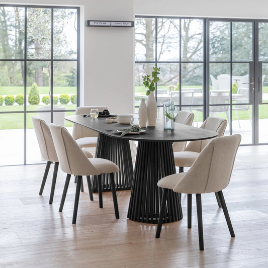 Modern Scandinavian Dining Table Black, set in a modern home with 6 dining chairs.