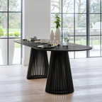 Modern Scandinavian Dining Table Black, set in a modern home, front view.