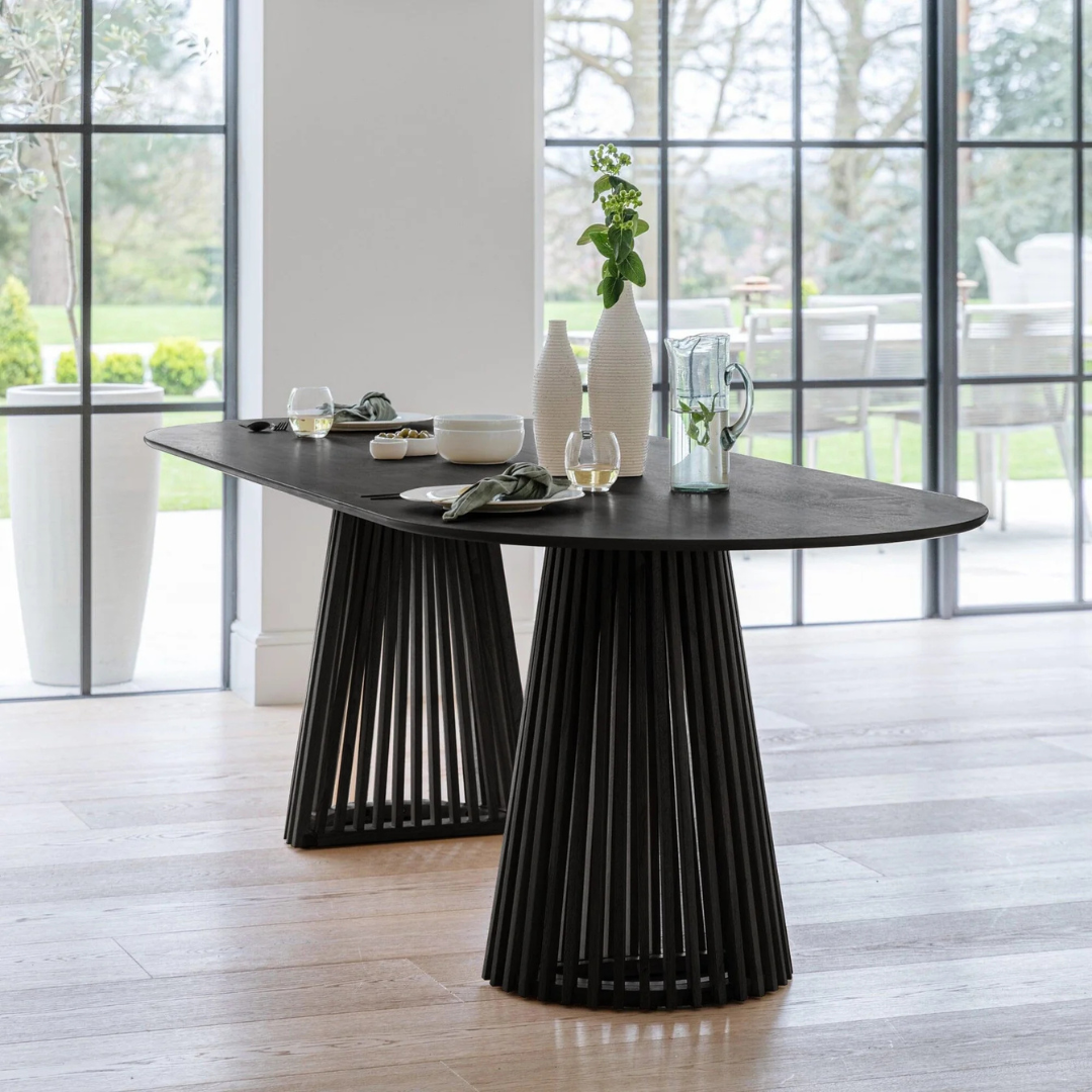 Modern Scandinavian Dining Table Black, set in a modern home, front view.