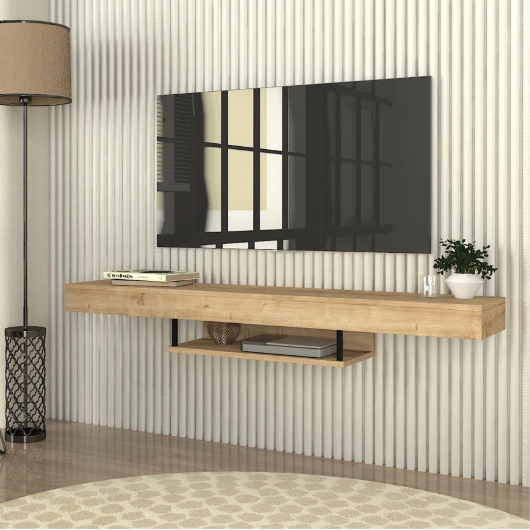Oak Finish Floating TV Shelf, angled view, sat underneath a TV.