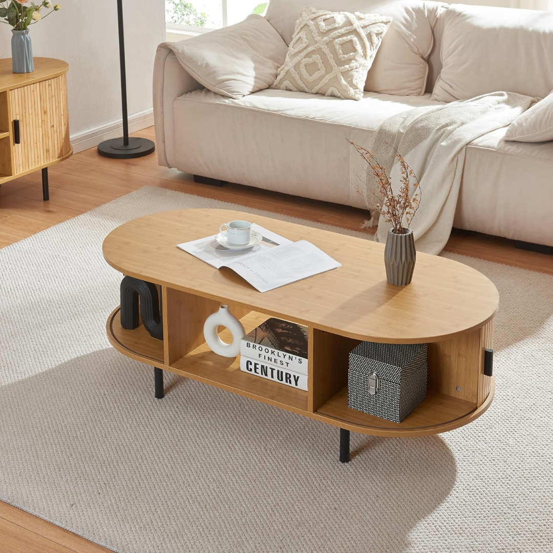 Wooden coffee table in a living room with a couch and decorative items.