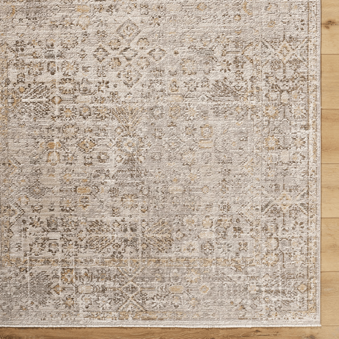 Patterned rug on a wooden floor