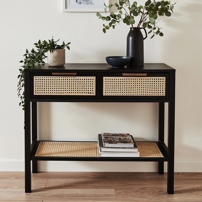 Rattan Black Wooden Console Table, front view in a model home.