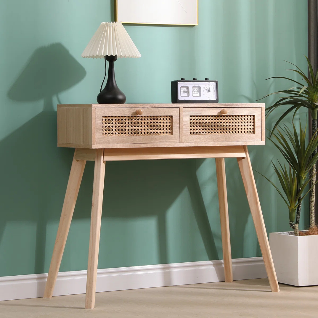 Rattan Hallway Table With Drawers, in a mid century home, angled view.