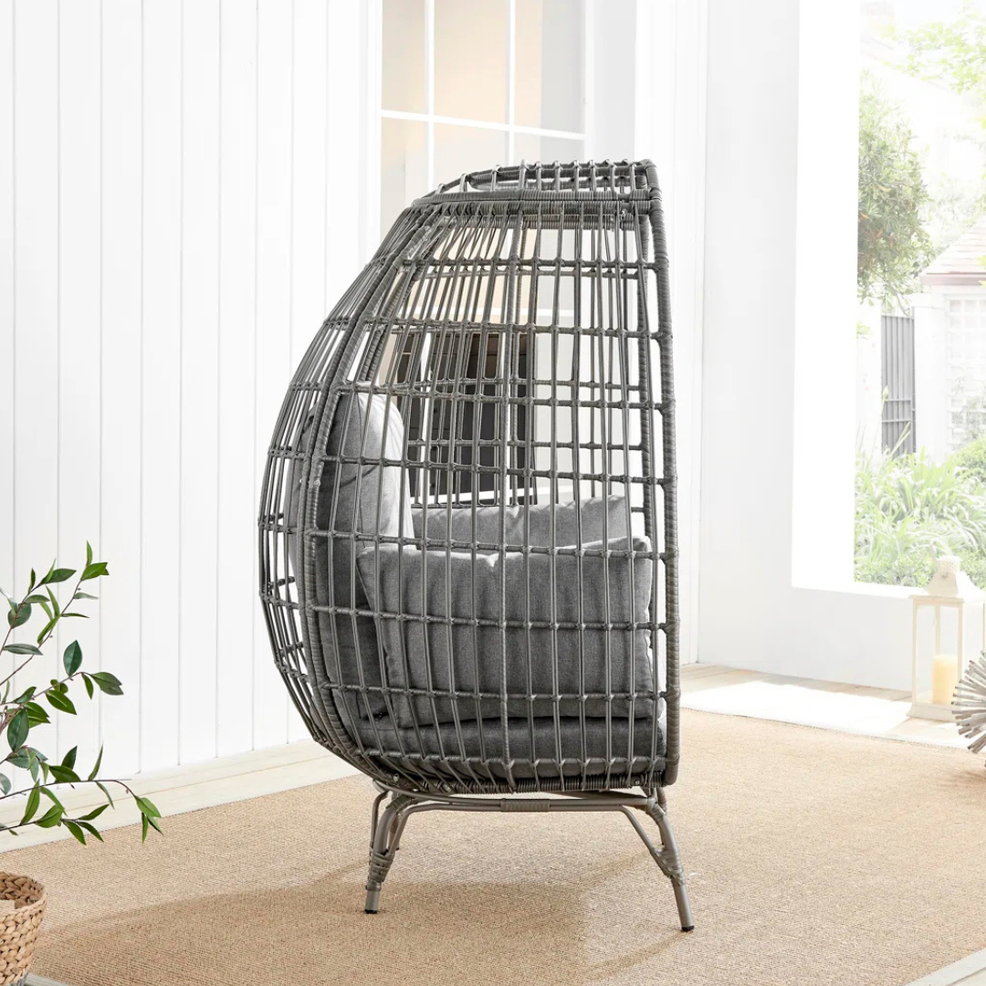 Rattan Standing Egg Chair, in a modern home, side view.