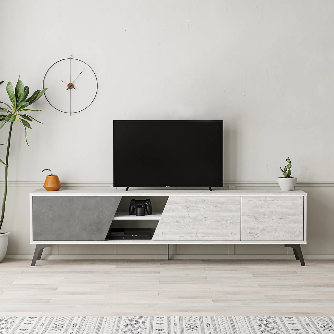 Modern TV stand with a television in a minimalistic living room.